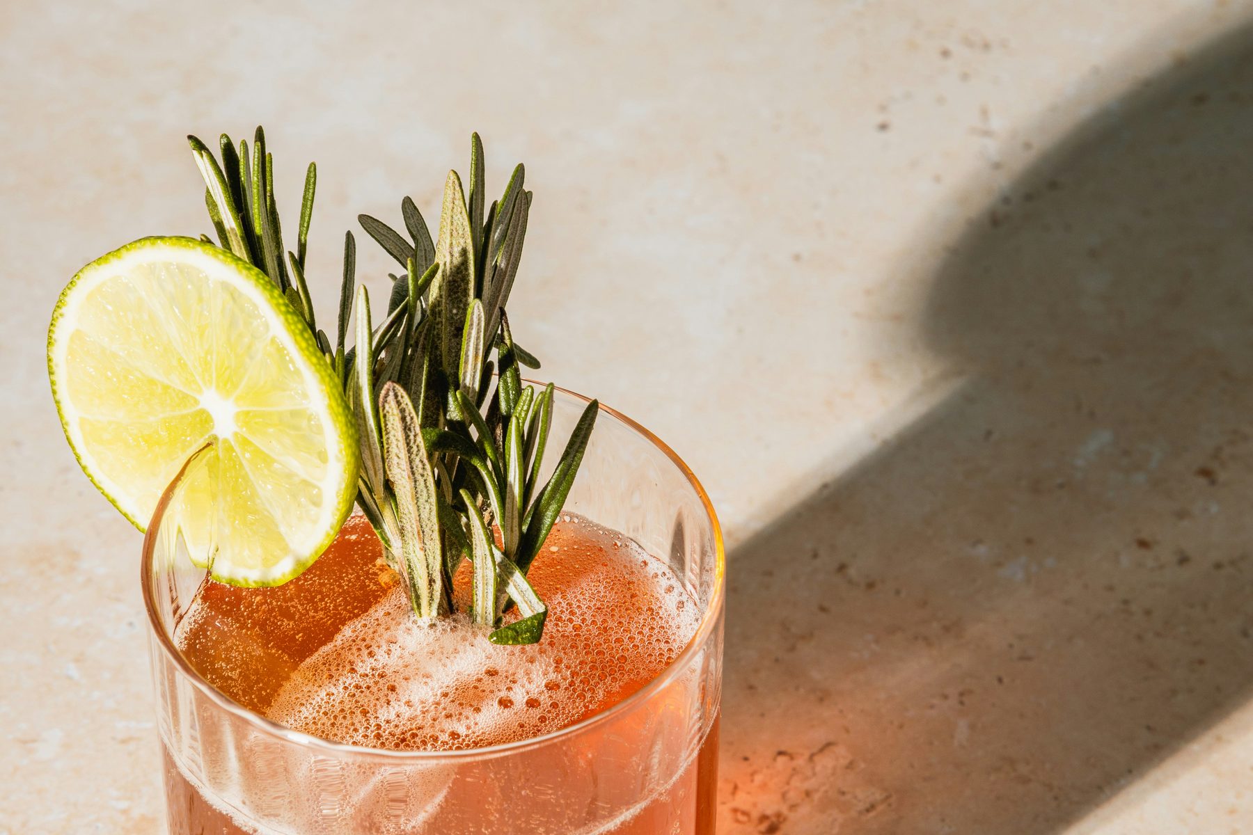 A chilled premix beverage poured and garnished in a glass, the result a formulation has to repeat every time